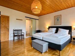 Rúm í herbergi á Haus 26 Weißbriach