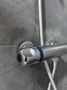 a close up of a toothbrush holder in a shower at Royal Racing Suite Top 3 near Red Bull Ring in Judenburg