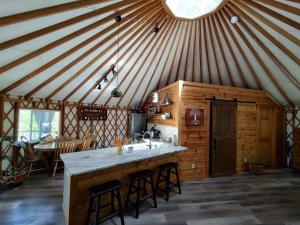 a kitchen with a large island in a yurt at Healing Acres in Brevard