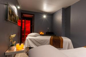 Postel nebo postele na pokoji v ubytování 1850 Hotel Boutique