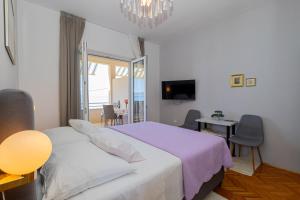 Posteľ alebo postele v izbe v ubytovaní Marin Apartments