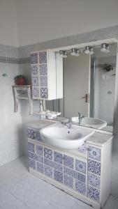 a bathroom with a sink and a mirror at Orion House in Pianella