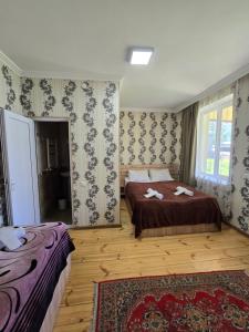Ένα ή περισσότερα κρεβάτια σε δωμάτιο στο Hotel Garbani