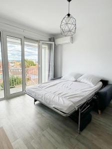 Posteľ alebo postele v izbe v ubytovaní Appartement centre ville 4 personnes à Palavas les flots