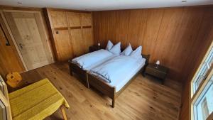 Postel nebo postele na pokoji v ubytování Chalet Bärgsunne