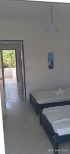 Posteľ alebo postele v izbe v ubytovaní Lemonis House