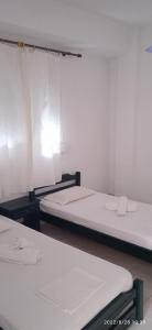 Postel nebo postele na pokoji v ubytování Lemonis House