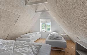A bed or beds in a room at 1 Bedroom Cozy Apartment In Svendborg