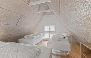 A bed or beds in a room at 1 Bedroom Cozy Apartment In Svendborg