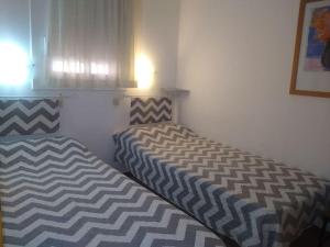 Giường trong phòng chung tại Appartement T3 de 6 places en bord de mer