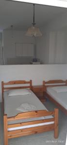 Postel nebo postele na pokoji v ubytování Lemonis House