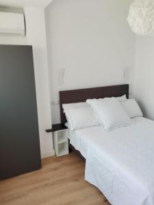 Ένα ή περισσότερα κρεβάτια σε δωμάτιο στο Apartamento Claudia