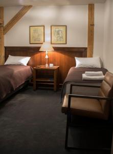 Кровать или кровати в номере Hotel Retro B.A. Zientarski