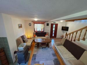 a living room with a couch and a table at Villa Enigma in Bihać