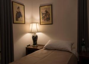 Postel nebo postele na pokoji v ubytování Hotel Retro B.A. Zientarski