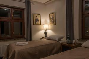 Postel nebo postele na pokoji v ubytování Hotel Retro B.A. Zientarski