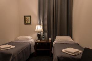 Postel nebo postele na pokoji v ubytování Hotel Retro B.A. Zientarski
