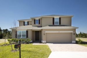 a large house with a garage in a yard at Sruthan Kerith in Davenport