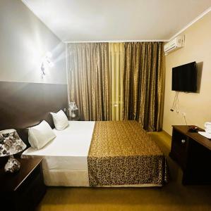 En eller flere senge i et værelse på Studio Festa Pomorie