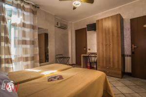 Postel nebo postele na pokoji v ubytování Hotel Bel Sit