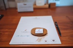 a ring on top of a paper on a table at Hotel Cucuve in Puerto Ayora