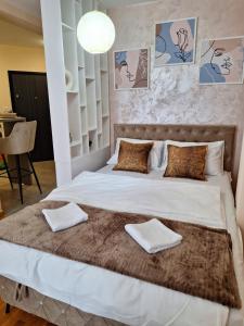 Postel nebo postele na pokoji v ubytování Apartman M&M