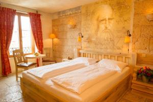Un pat sau paturi într-o cameră la 4-Sterne Superior Erlebnishotel Colosseo, Europa-Park Freizeitpark & Erlebnis-Resort