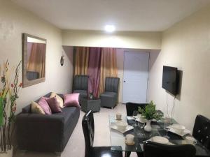 a living room with a couch and a table at SDQ Apartamento Marbella 2 in La Ureña