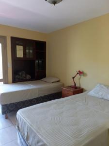 Ένα ή περισσότερα κρεβάτια σε δωμάτιο στο La Casa de Pedro Hostel