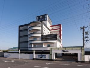 a building with a sign on top of it at HOTEL SEEN - OCEAN TERRACE - (Adult Only) in Taketoyo