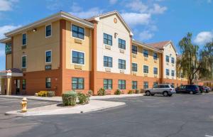 a large building with a parking lot in front of it at Extended Stay America Suites - Phoenix - Chandler in Phoenix