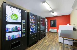 a soda machine in a room with a table at Extended Stay America Suites - Phoenix - Chandler in Phoenix