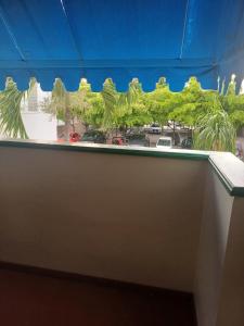 a window with a view of a street at royal at courtleigh towers in Kingston