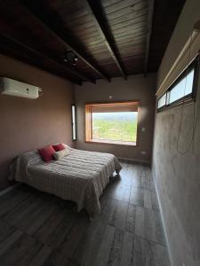 Ένα ή περισσότερα κρεβάτια σε δωμάτιο στο Cuatro Soles
