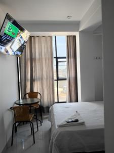 Postel nebo postele na pokoji v ubytování Hostal Huella