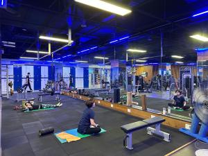 a group of people exercising in a gym at Hotel French code Myeongji in Busan