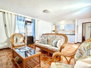 a living room with a couch and chairs at Casa Luce seaside in Puerto del Carmen