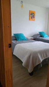 A bed or beds in a room at Casa campo, familiar