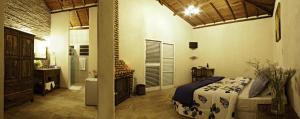 Tempat tidur dalam kamar di Pousada Eldorado Das Gerais