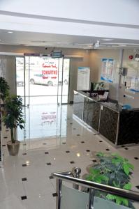 a store with a white car on the window at شقق المكان الراقي للشقق المخدمة in Riyadh