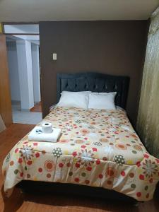 Rúm í herbergi á Hostal Ayllu