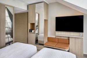 Postel nebo postele na pokoji v ubytování Courtyard by Marriott Magdeburg