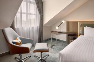Postel nebo postele na pokoji v ubytování Courtyard by Marriott Magdeburg