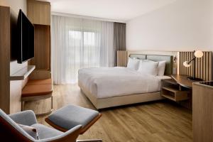 Postel nebo postele na pokoji v ubytování Courtyard by Marriott Magdeburg