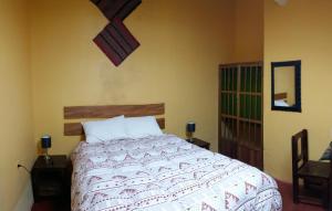 Ένα ή περισσότερα κρεβάτια σε δωμάτιο στο Hospedaje Familiar Kitamayu Pisac