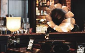 a bar with a wooden cloche on a table at Alagon D'antique Boutique Hotel & Spa in Ho Chi Minh City +49 photos