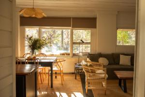 a living room with a table and a couch at Mimosa Wines in Murrah +19 photos