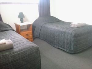 Postel nebo postele na pokoji v ubytování Rangiora Lodge Motel