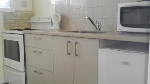 Kuchyň nebo kuchyňský kout v ubytování Rangiora Lodge Motel