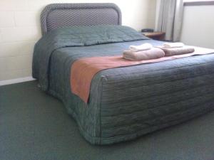 Postel nebo postele na pokoji v ubytování Rangiora Lodge Motel